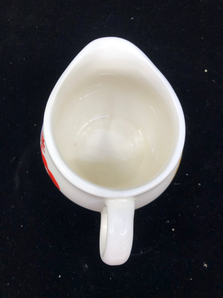 2 PC WHITE W/ RED/PURPLE FLOWERS SUG/CREAMER SET.