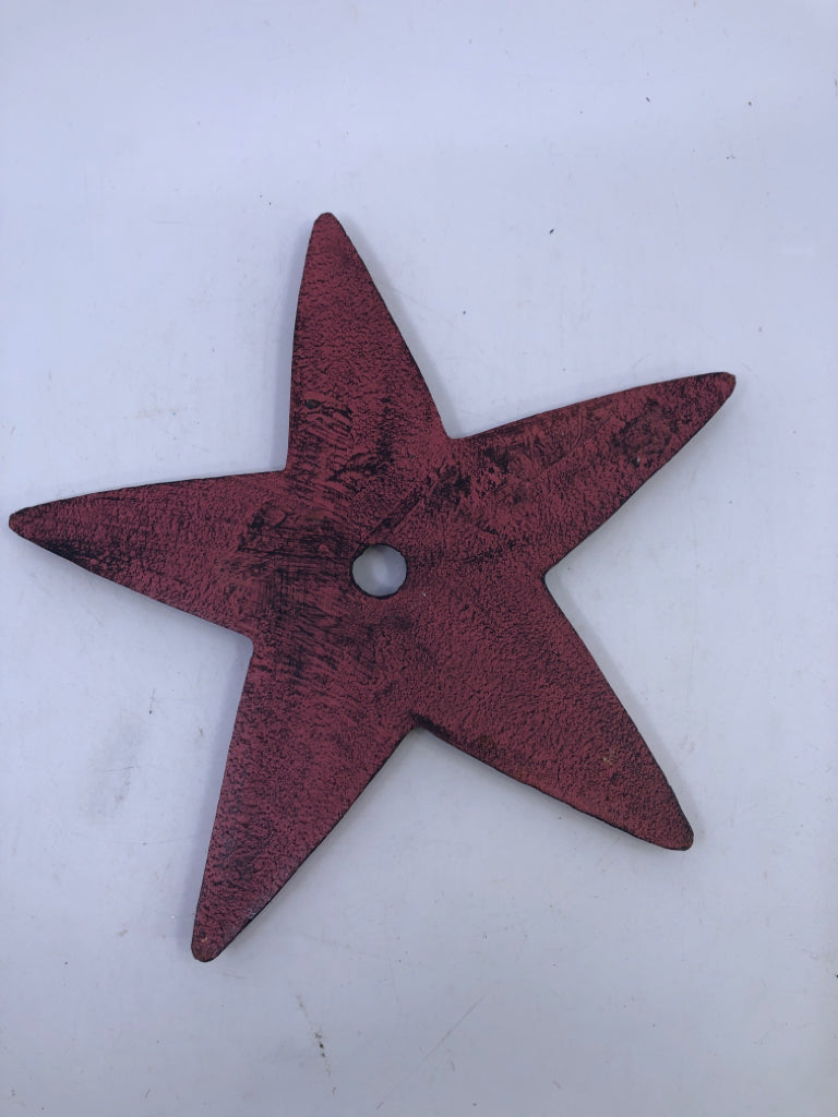PRIMITIVE RED STAR W HOLE IN MIDDLE.