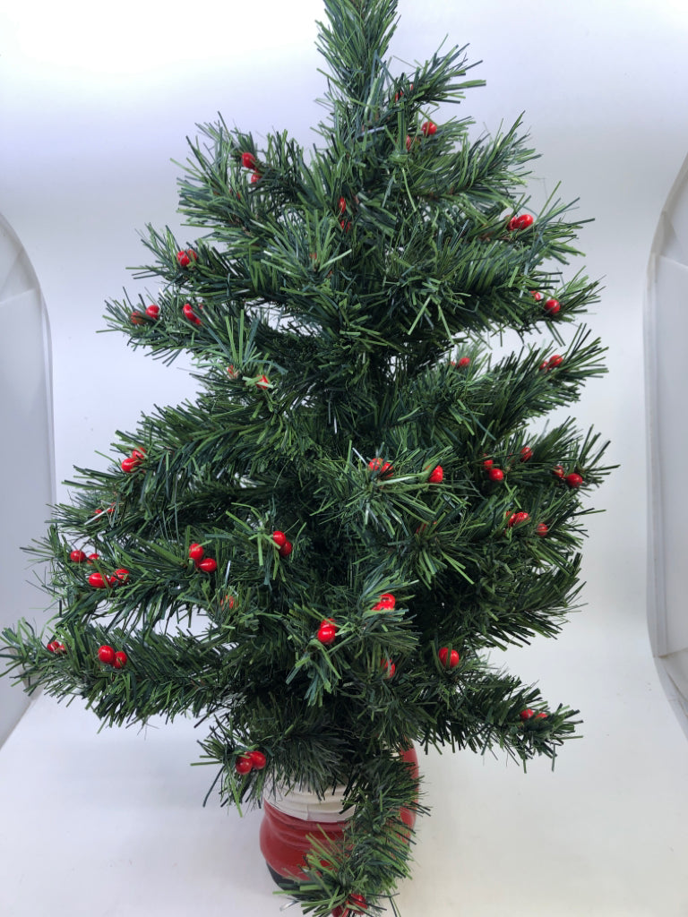 MINI HOLLY TREE IN SANTAS BOOT.