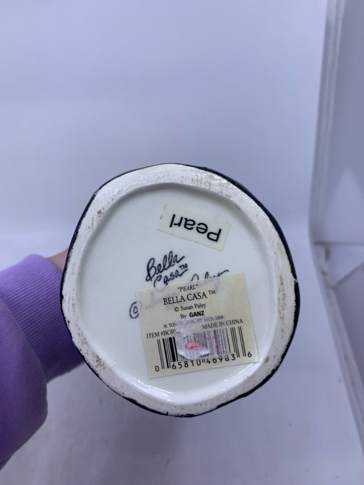 WOMAN SHAPED VASE W/ BLACK DRESS FLOWER NECKLACE.