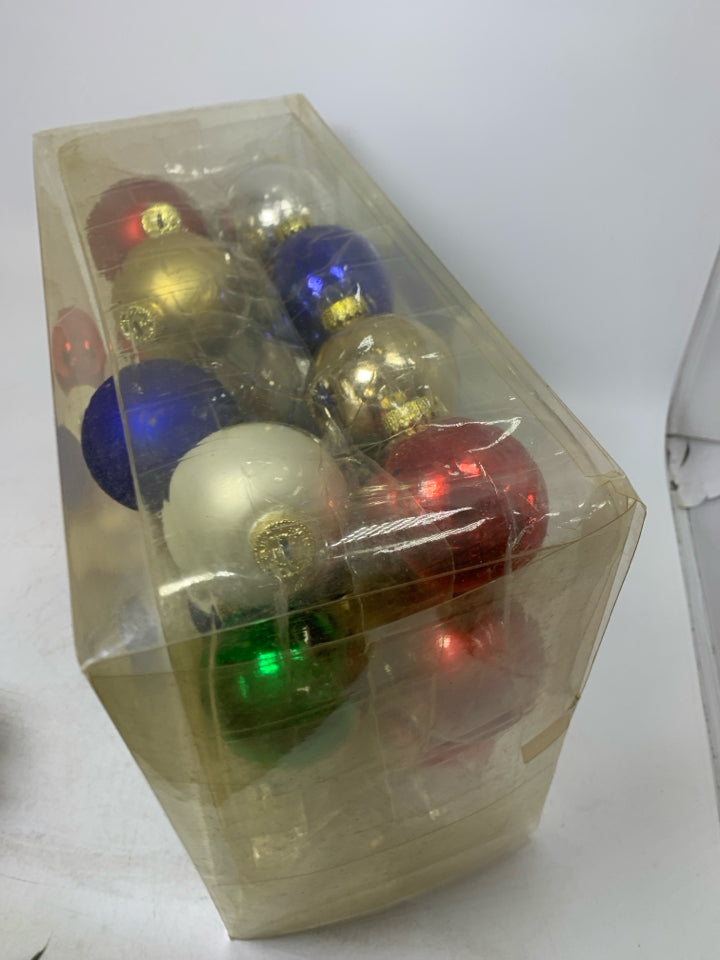 IN BOX 26 ASSORTED COLORS GLASS ORNAMENTS.