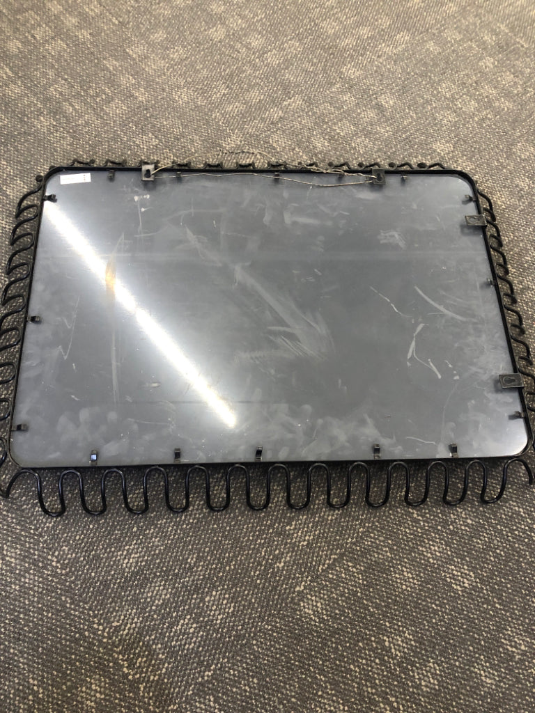 BLACK METAL FRAMED WALL MIRROR.