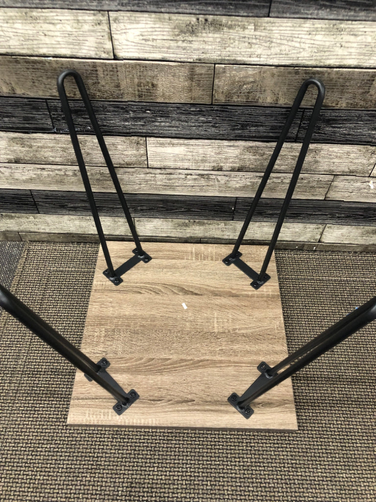 FAUX GREY WOOD SIDE TABLE W/ BLACK METAL PIN HAIR LEGS.