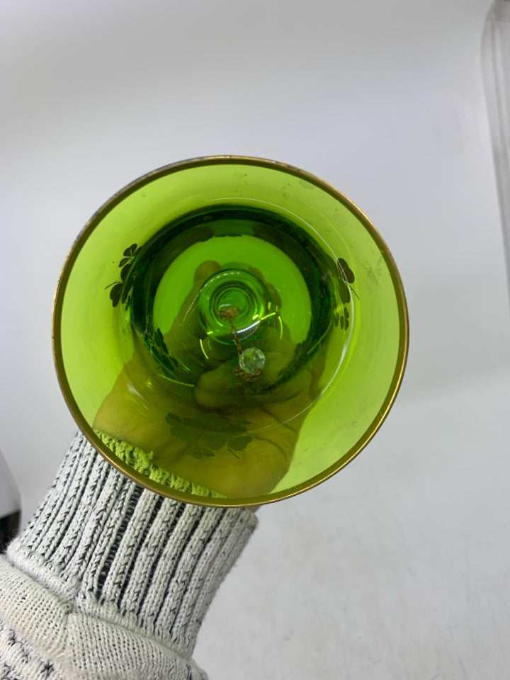 GREEN GLASS BELL W/ GOLD PAINTED SHAM ROCKS.