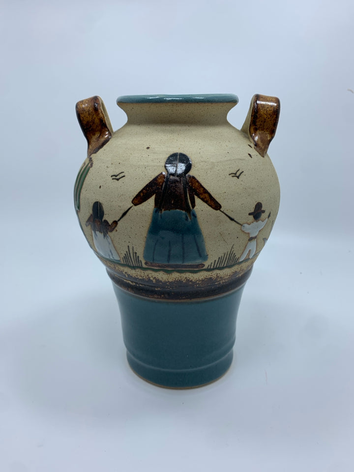 MOTHER AND CHILDREN TEAL GLAZED POTTERY VASE.