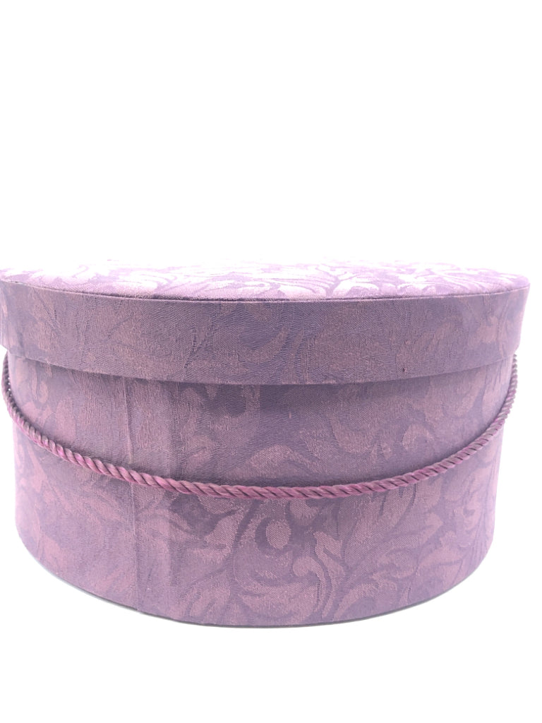 2 NESTING PURPLE FABRIC CIRCLE HAT BOXES.