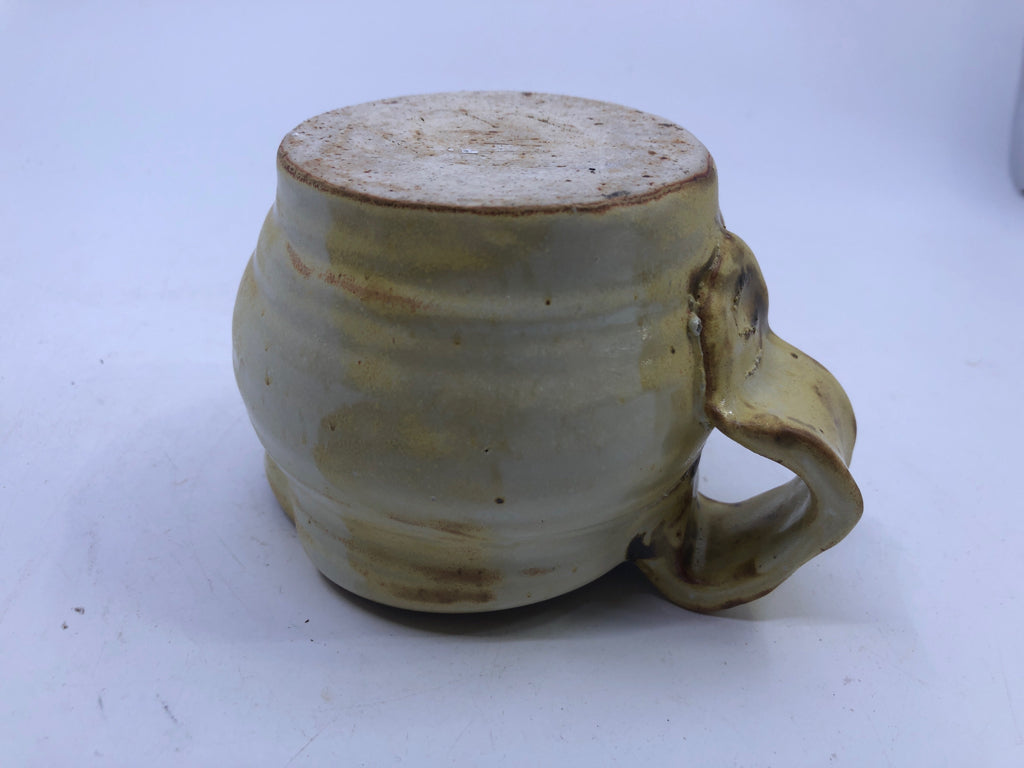 BROWN AND YELLOW COW PATTERN CREAMER.
