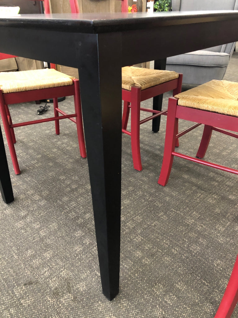 BLACK CONTEMPORARY TABLE & 4 RED CHAIRS W/WICKER SEAT.