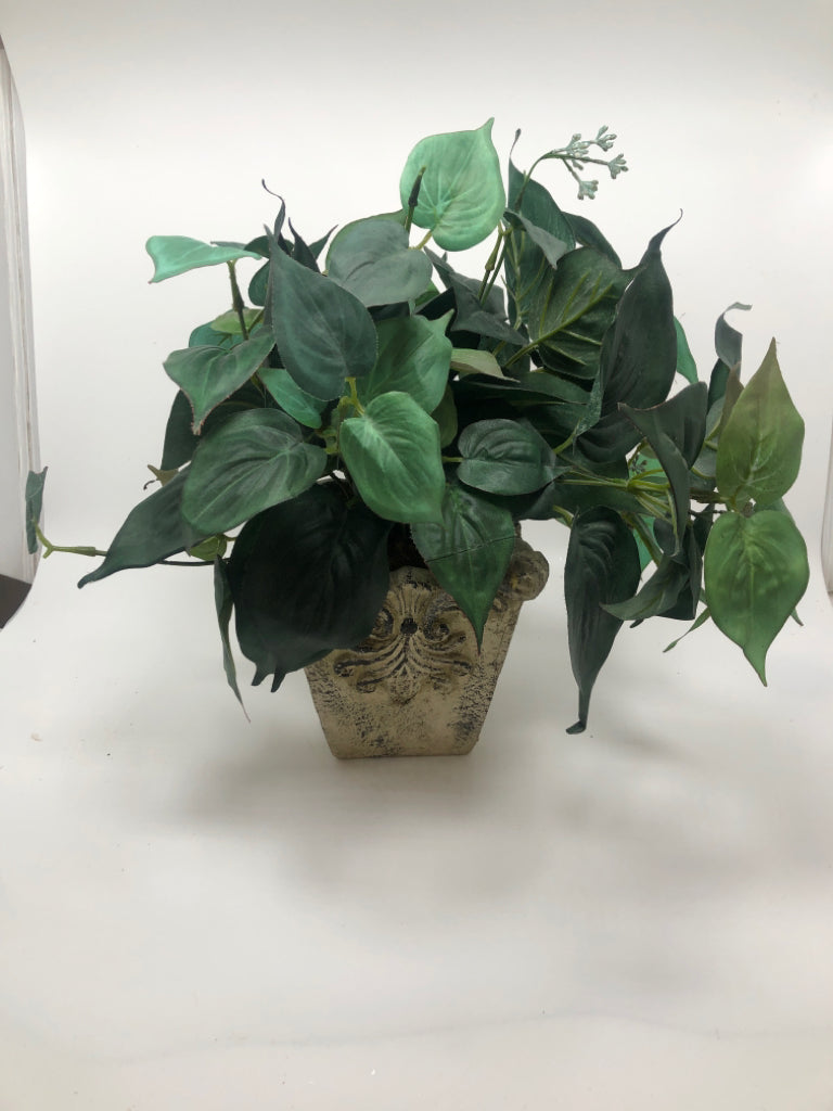 GREENERY IN FAUX STONE POT.