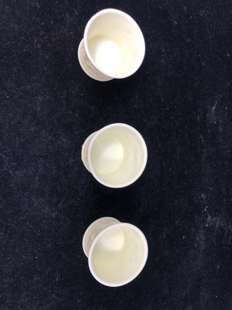 3 CREAM EMBOSSED YANKEE CANDLE TEALIGHT HOLDERS.