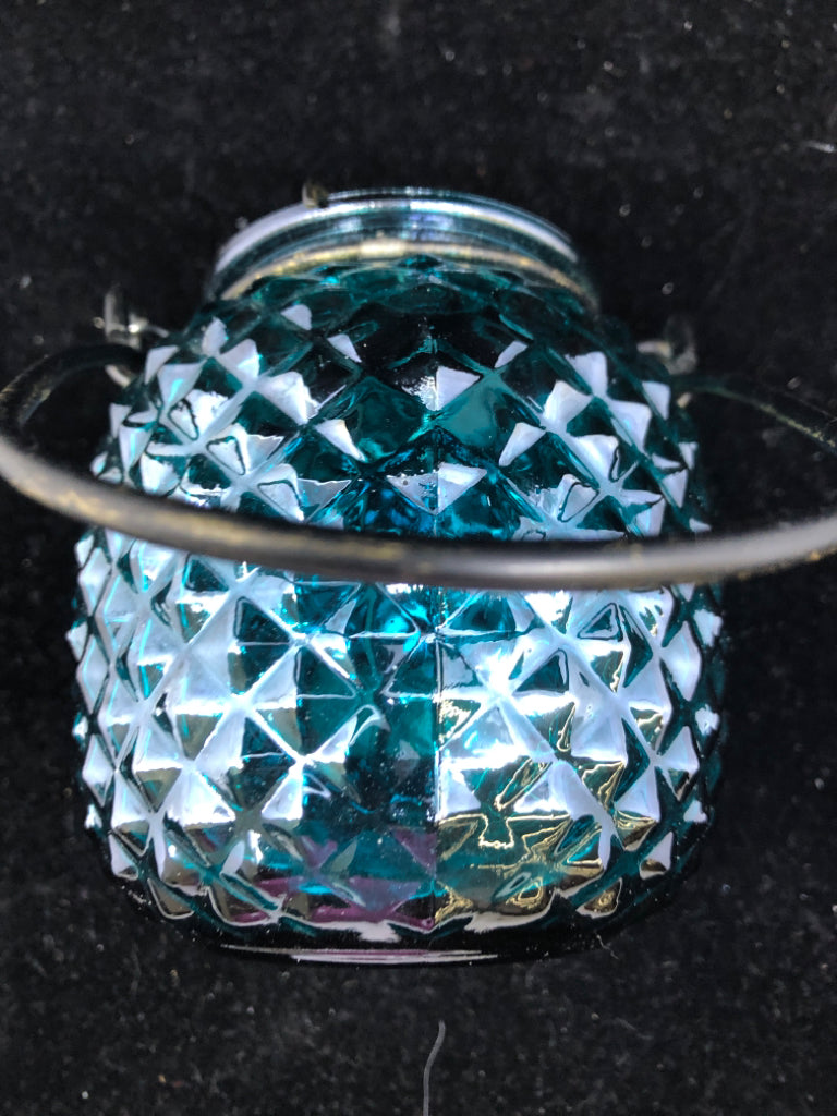 TEAL GLASS LANTERN TEA LIGHT HOLDER.