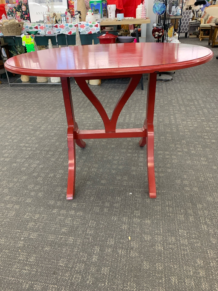 OVAL RED FLIP TOP TABLE.