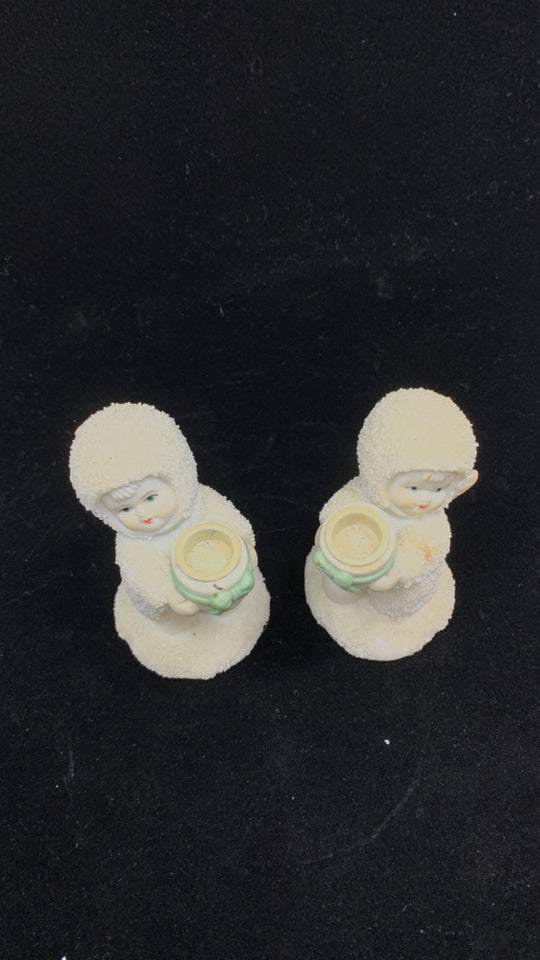 2 SNOW BABY HOLDING BOWL W/RIBBON CANDLE HOLDER.