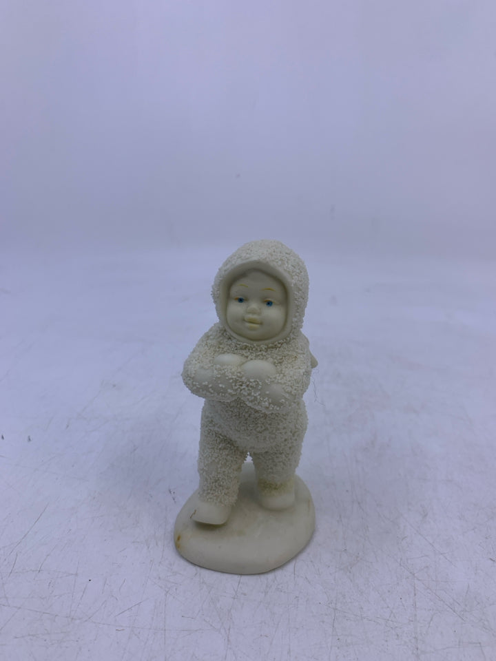 SNOW BABY HOLDING 2 SNOWBALLS WALKING.