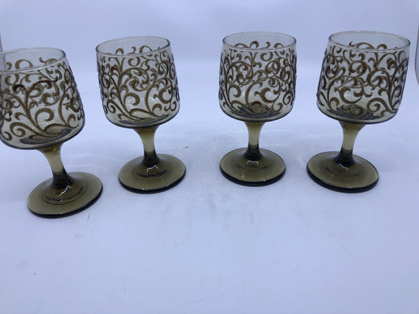 4 BROWN SCROLL FOOTED GLASSES.