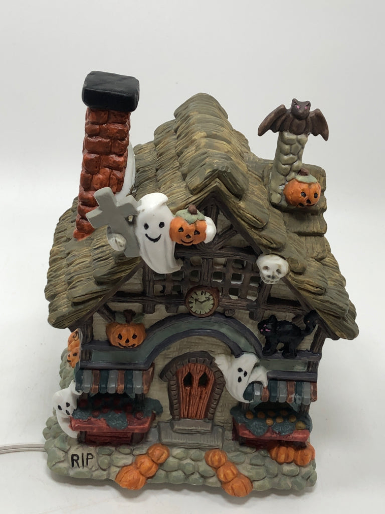 PORCELAIN ILLUMINATED HAUNTED HOUSE W/GHOSTS.