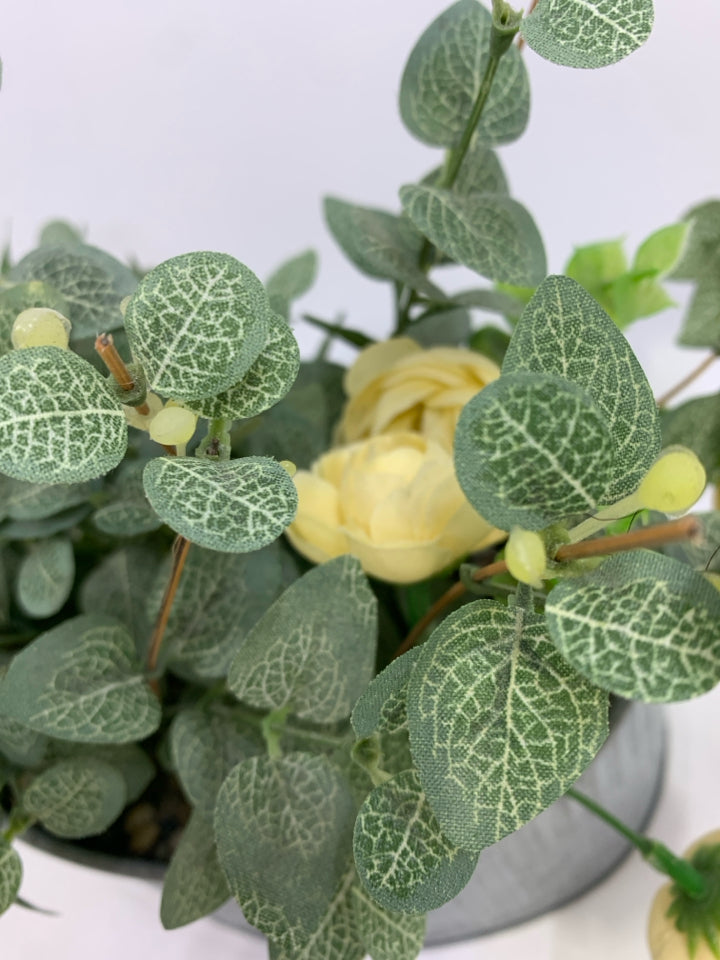 FAUX LEAVES & CREAM FLOWERS IN GALVANIZED TIN.