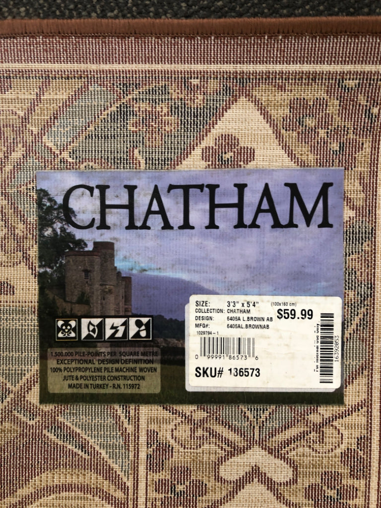 BROWN CHATHAM FLORAL RUG.