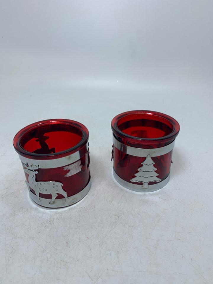 2 RED GLASS TEALIGHT HOLDERS W/ METAL TREE DEER CUT OUTS.