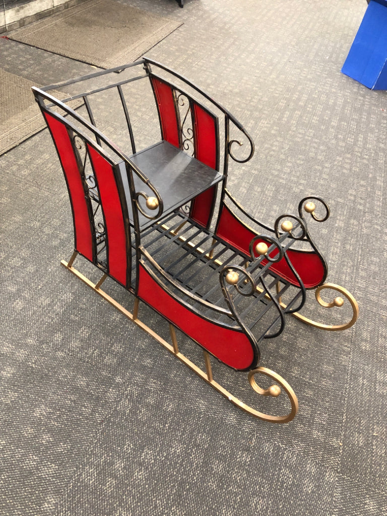 DISTRESSED METAL AND STAINED GLASS SLEIGH.