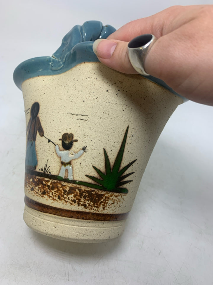 BASKET VASE W/ MOTHER/SON HOLDING HANDS LOOKING OUT LIGHT BLUE EDGES.