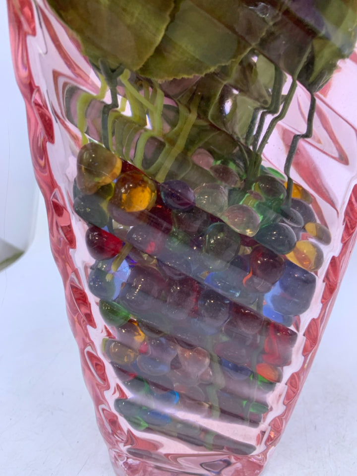 RIBBED PINK GLASS VASE W/ MARBLE FILLER PURPLE/PINK FLOWERS.
