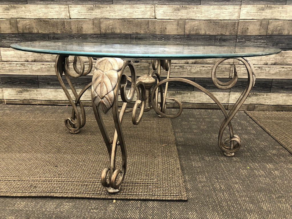 GLASS CIRCLE COFFEE TABLE W/ DISTRESSED SLIVER BASE/LEGS.