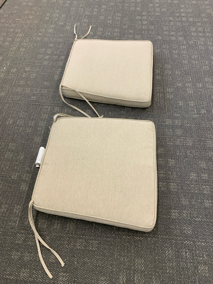 2 TAN CHAIR CUSHIONS.