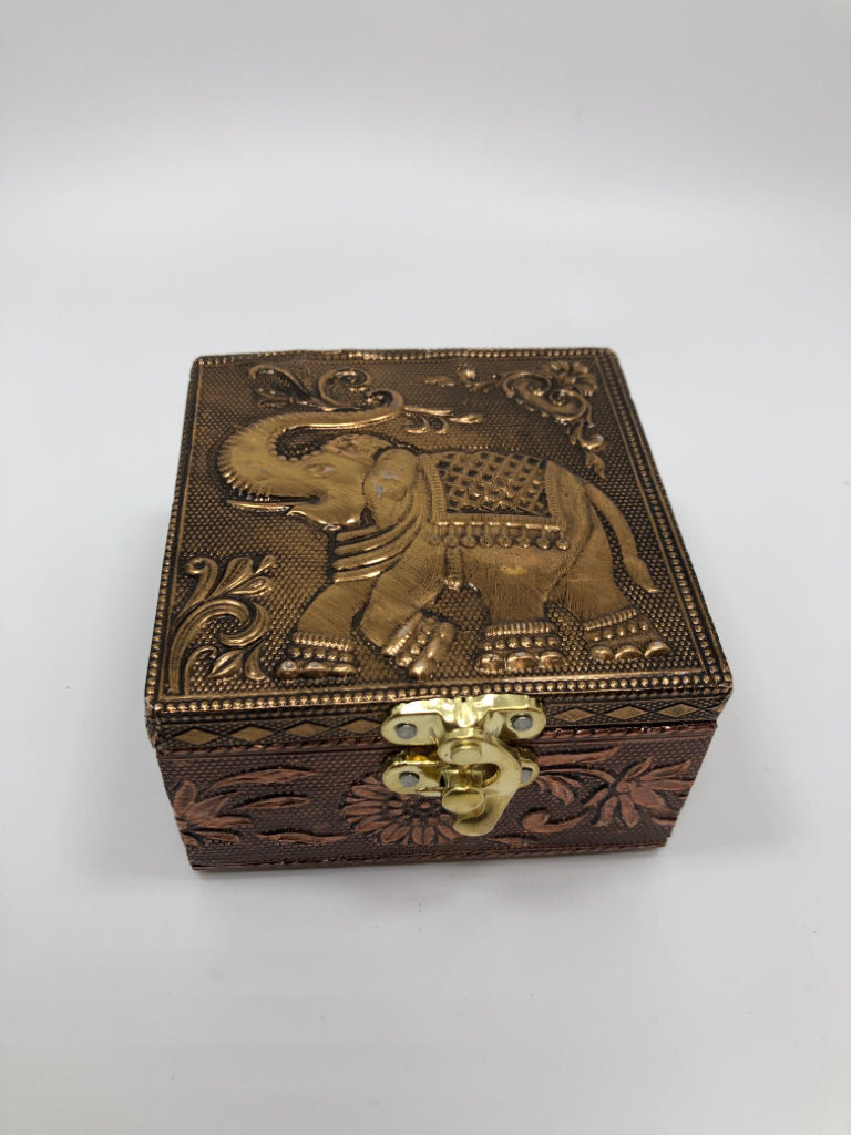 GOLD ELEPHANT BOX W/RED FABRIC LINING.