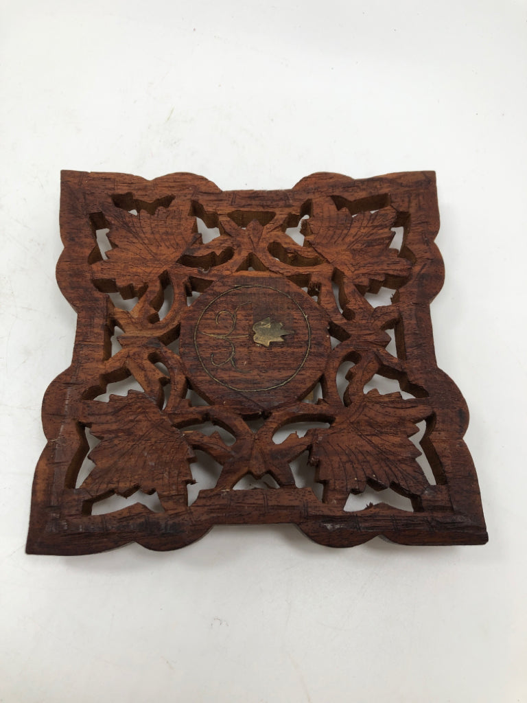 HAND-CARVED WOODEN TRIVET W/FLOWER CENTER.