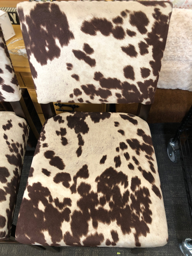 2-FAUX COW HIDE DARK WOOD STOOLS.