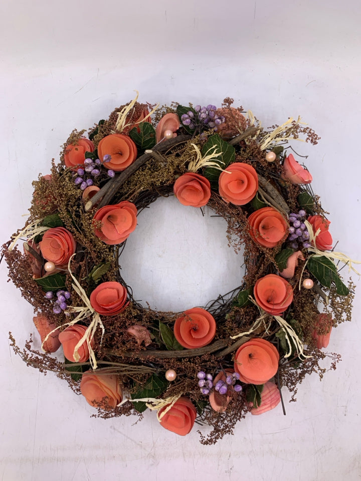 REAL DRIED FLOWERS STICK WREATH W/ PAPER ROLLED PINK FLOWERS.