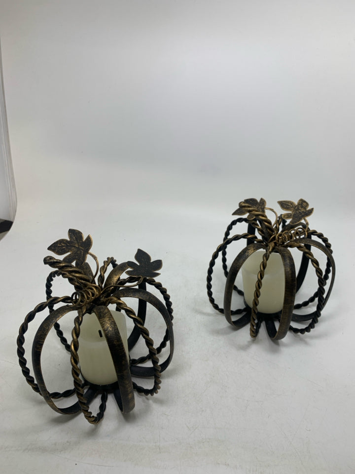 2 METAL PUMPKIN CAGE TEALIGHT HOLDERS BRONZE W/ FAUX CANDLES.