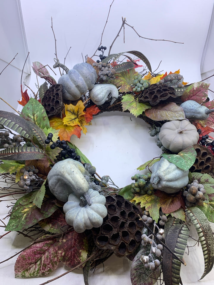 BLUE FAUX FLORAL TWIG WREATH.