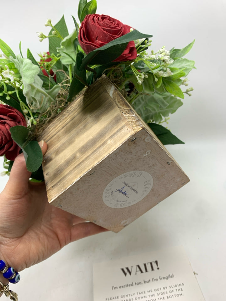 FAUX WOOD FLOWERS WITH TAG IN DISTRESSED WOOD POT.