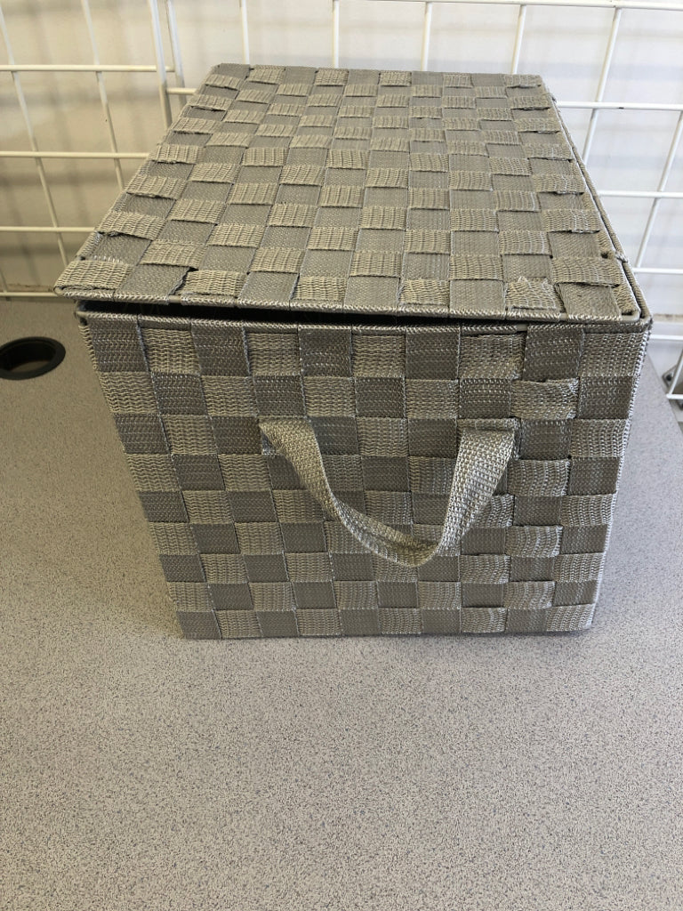 GRAY CLOTH WOVEN BASKET W/ ATTACHED LID.