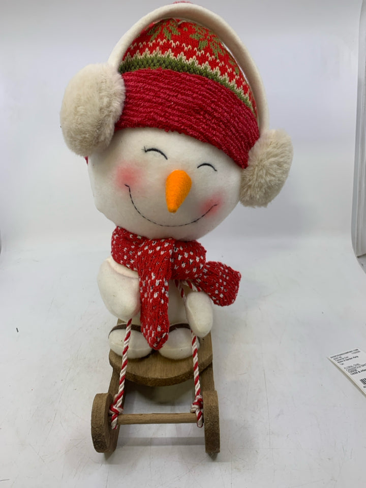 LARGE PLUSH SNOWMAN ON SLED.