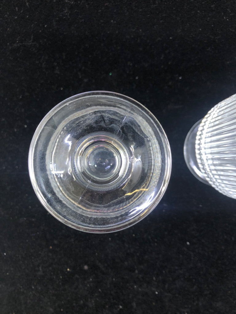 2 RIBBED GLASS FOOTED GLASSES.