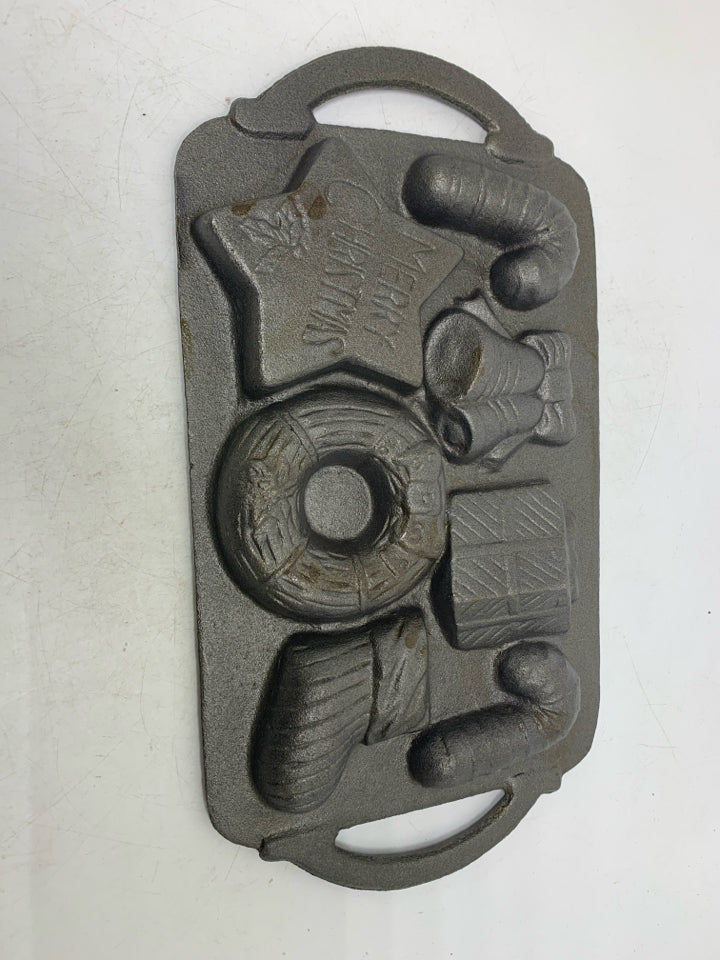 VTG 7 SLOT ASSORTED HOLIDAY THEME CAST IRON BAKING PAN.