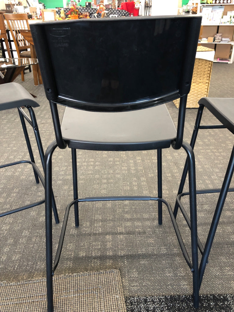 4 BLACK PLASTIC IKEA BAR STOOLS.