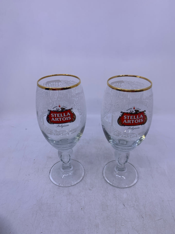 2 STELLA ARTOIS BEER GLASSES GOLD RIM.