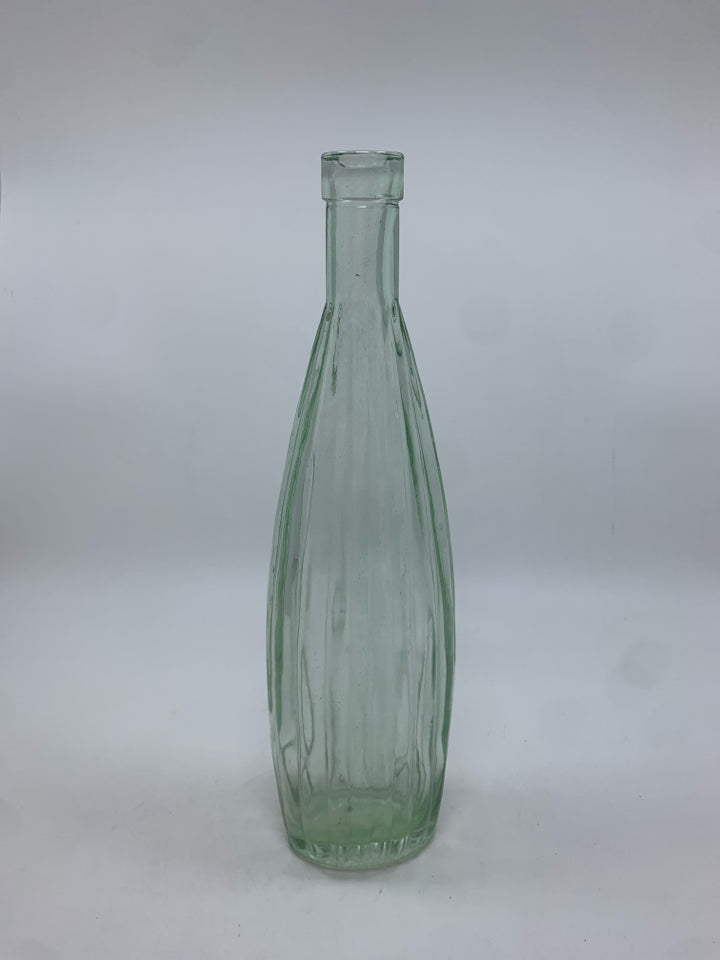 CLEAR GLASS RIBBED BOTTLE.