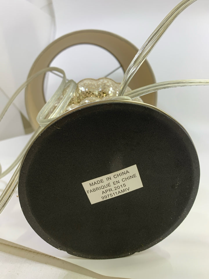 ROUND CRACKLE GLASS BASE LAMP W/TAN SHADE.