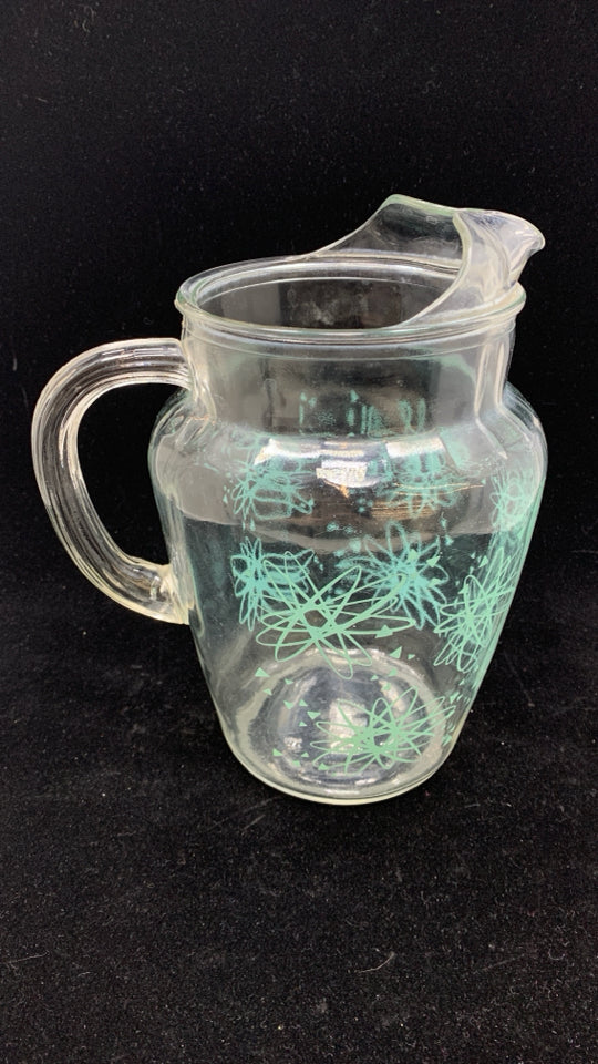 VTG TEAL STARBURST GLASS PITCHER W/ICE LIP.