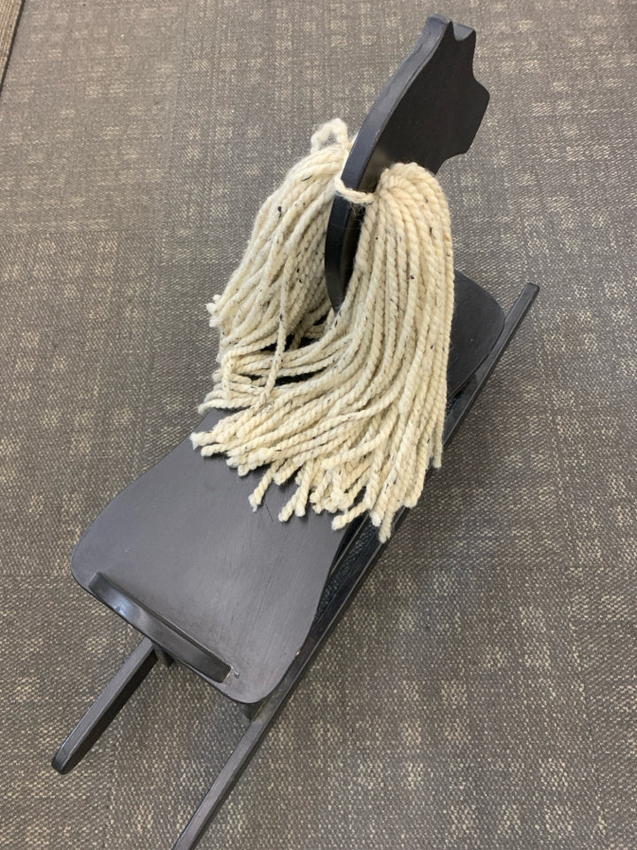 BLACK WOOD ROCKING HORSE W/YARN HAIR.