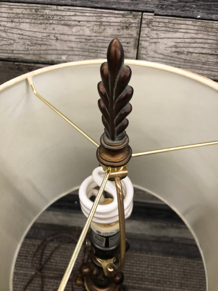 BRONZE SCROLL BASE LAMP W/BROWN SHADE.