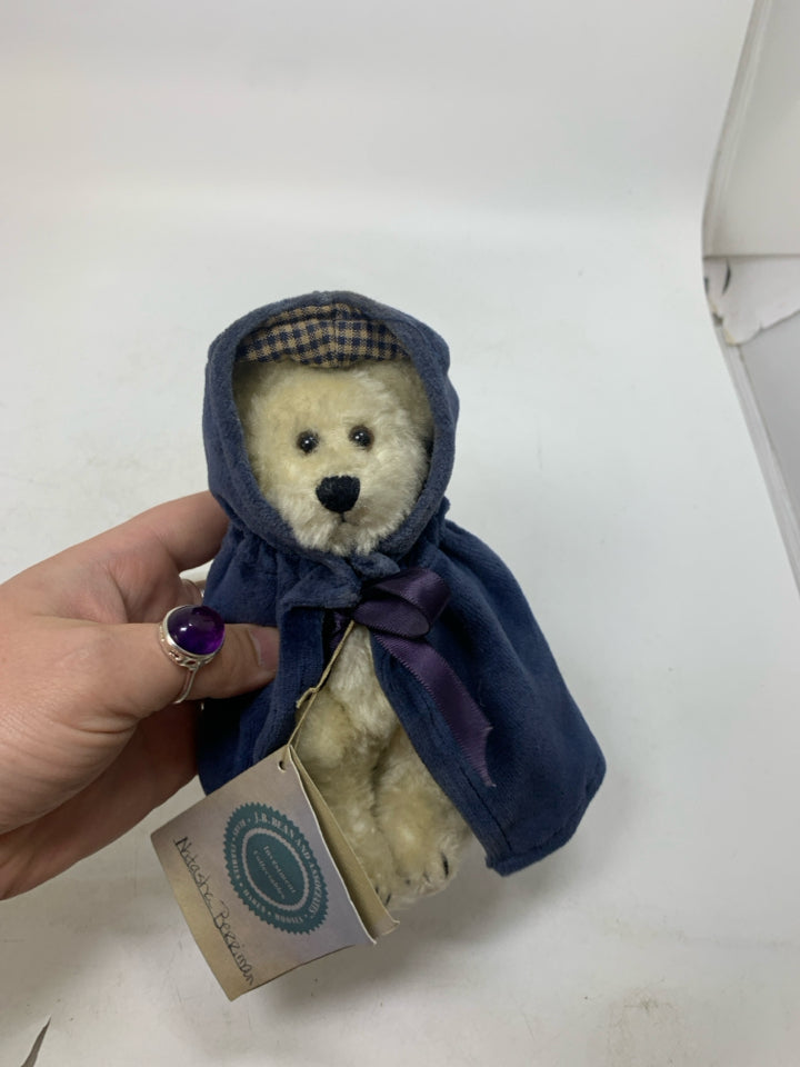 SMALL WHITE BOYDS BEAR W/ NAVY CLOAK.