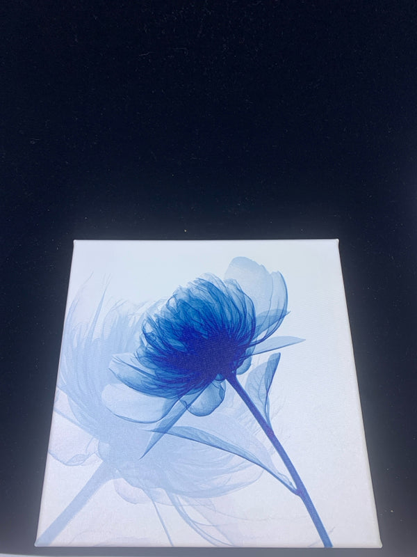 BLUE FLOWER IN WHITE CANVAS WALL HANGING.