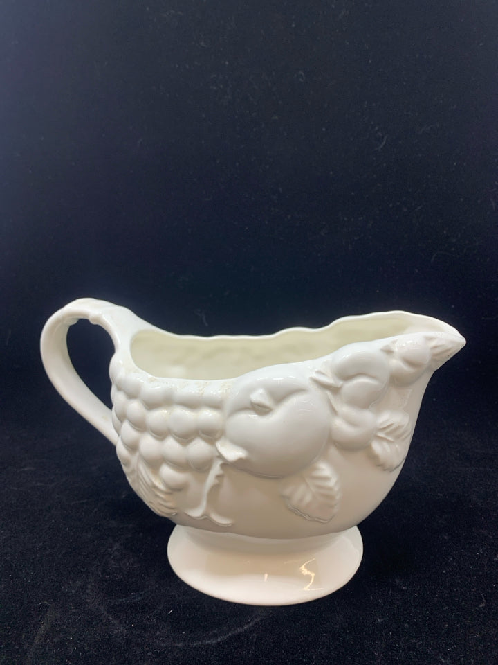 WHITE CERAMIC GRAVY BOAT W/EMBOSSED FRUIT.