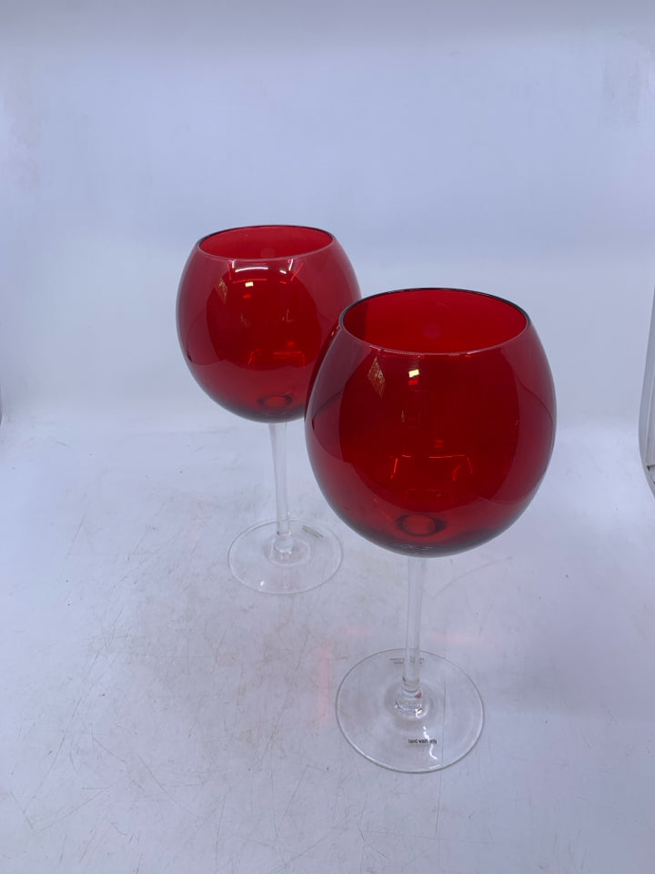 2 CLEAR GLASS STEM W/ RED TOP WINE GLASSES.